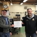 David Barnhill receiving the Employee of the Quarter (first quarter) recognition in April 2020 recognition from Nick Katers, Associate Vice Chancellor of Facilities Management. Note the respectful distance required by the earliest COVID-19 protocols.