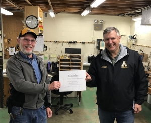 David Barnhill receiving the Employee of the Quarter (first quarter) recognition in April 2020 recognition from Nick Katers, Associate Vice Chancellor of Facilities Management.  Note the respectful distance required by the earliest COVID-19 protocols.